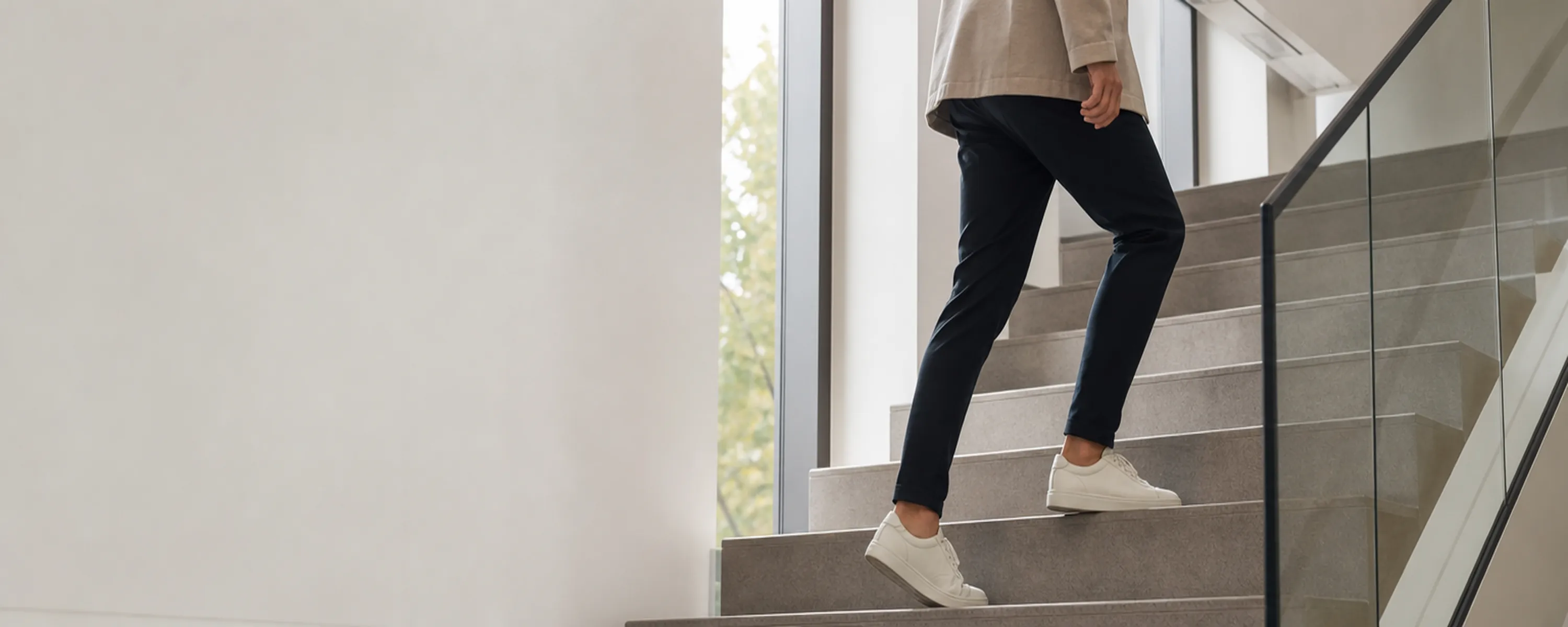 adult taking the stairs to increase daily non-exercise activity and raise TDEE